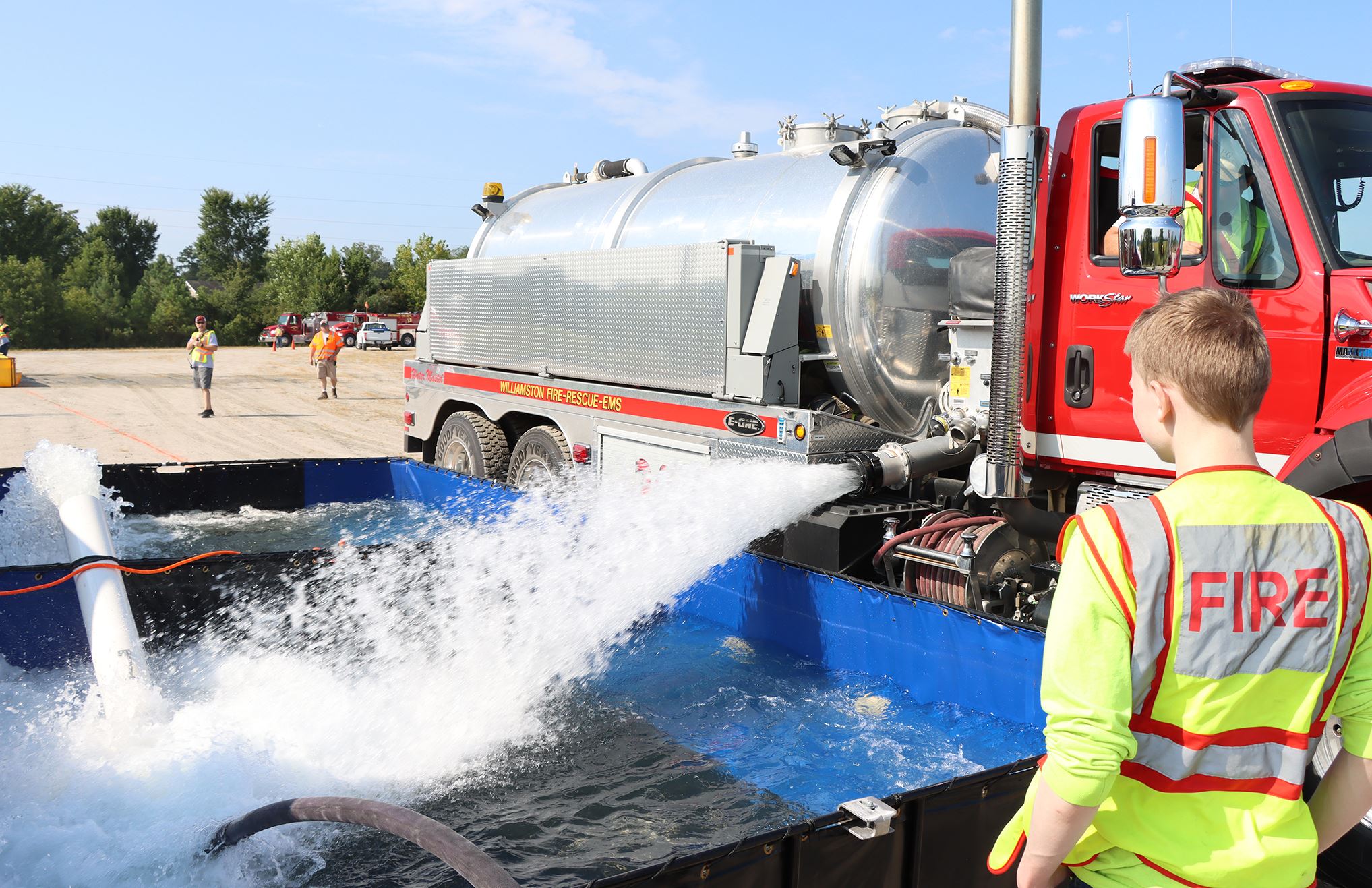 A crew member looks on during the water shuttle operation
